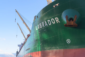 Naklejka premium view of Labrador, a bulk cargo carrier docked at Lower Jarvis Slip, next to Redpath Sugar Refinery, near 95 Queens Quay E, Toronto