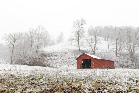Country red barn in winter 