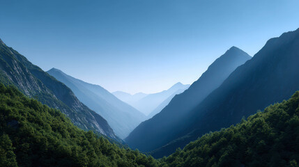 Fototapeta premium Majestic Valley Surrounded by Distant Mountain Silhouettes Under Clear Sky and Soft Light, Capturing the Essence of Natural Beauty and Tranquility