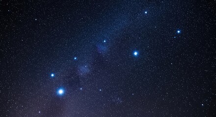 Fototapeta premium The night sky with the Orion constellation visible through a telescope.