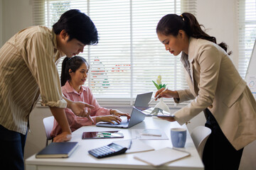 Business meeting. analyst team utilizing BI Fintech to analyze financial report with laptop. Businesspeople analyzing BI data dashboard displayed on laptop screen for business insight. Prodigy
