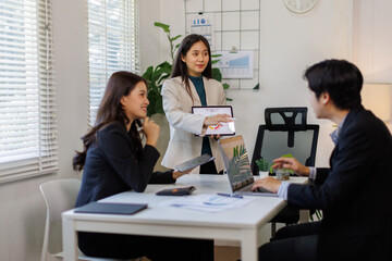 Sustainability and ESG. Professional explaining environmental strategies to engaged team members.

