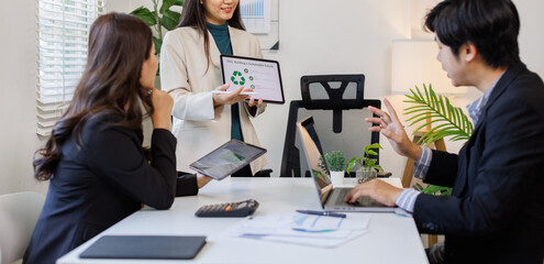 Sustainability and ESG. Professional explaining environmental strategies to engaged team members.

