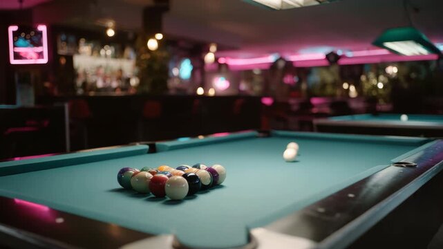 Pool table with balls ready for a break at a neon lit bar