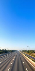Fototapeta premium Vast, car-free highway under a clear blue sky, highway, day