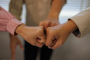 Business team standing hands together, Volunteer charity work. People join for cooperation success...