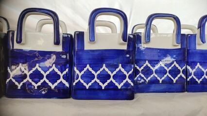 Handcrafted pots in the shape of the bag, close up view