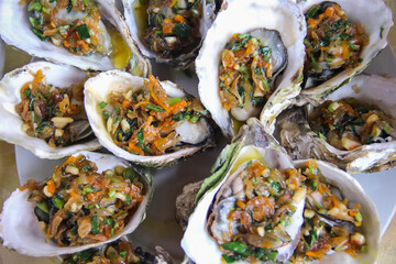 Top view oyster with sauce seafood background
