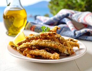 Fried fish with lemon and parsley, bottle of oil, in the background sea and towel