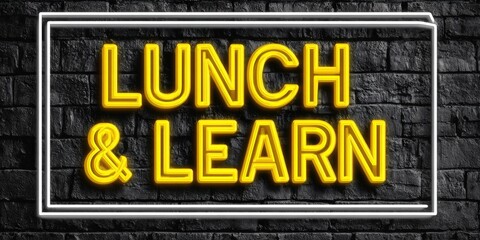 Obraz premium Neon Lunch And Learn Sign Glowing Yellow Text On Dark Brick Wall Background