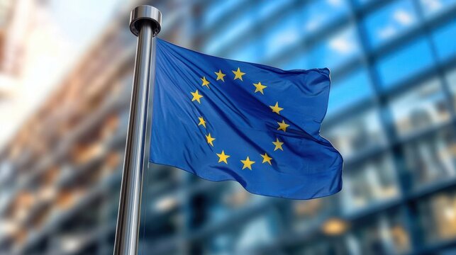 blue flag with a circle of yellow stars waving on a metal pole in front of a modern glass office building, conveying pride and unity on a windy day - Powered by Adobe