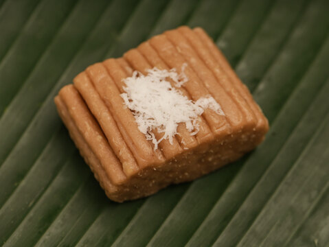 Gethuk Lindri, an Indonesian traditional snack made from cassava and shredded coconut, on banana leaf