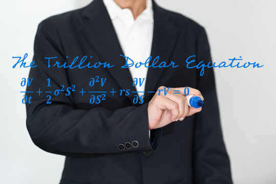 Businesswoman writing Black Scholes equation known as trillion dollar equation on transparent board