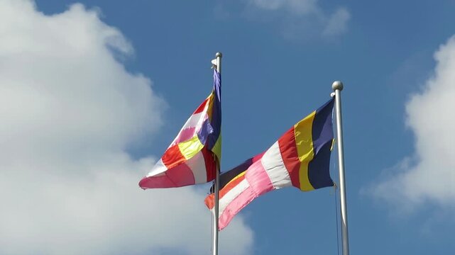Video Footage of colourful Buddhist Flags Fluttering in the wind at Botahtaung Pagoda in Yangon, Myanmar