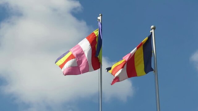 Video Footage of colourful Buddhist Flags Fluttering in the wind at Botahtaung Pagoda in Yangon, Myanmar