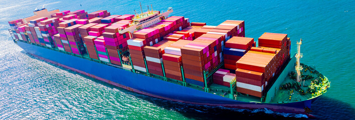 container ship, fully loaded with goods, sails out to sea, delivering products to various locations