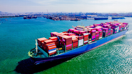 container ship, fully loaded with goods, sails out to sea, delivering products to various locations