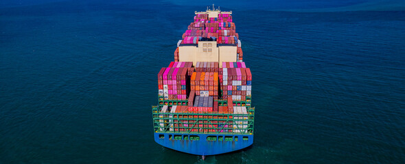container ship, fully loaded with goods, sails out to sea, delivering products to various locations