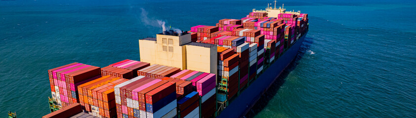container ship, fully loaded with goods, sails out to sea, delivering products to various locations