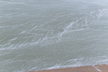 Winter landscape. Snowstorm on the river.
