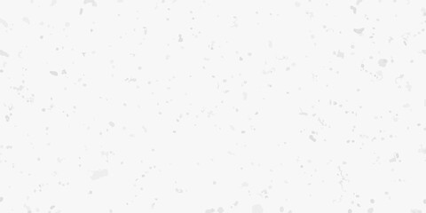 A textured grainy white background with subtle speckles and variations