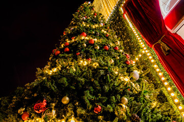 Christmas decoration with christmas tree, ball, gift. Decorated Christmas tree.