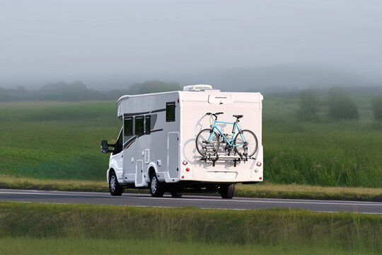 Fototapeta Scenic nature journey with camper and bicycle