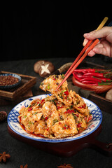 Spicy Chinese Chicken with Chopsticks and Red Chilies