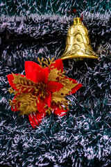 Close-up of a beautifully decorated ornament hanging on a artificial Christmas tree.