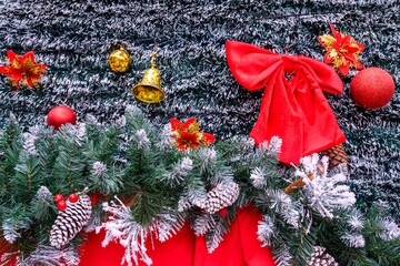 Close-up of a beautifully decorated ornament hanging on a artificial Christmas tree.