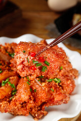 Traditional Chinese Fried Pork Balls with Chopsticks