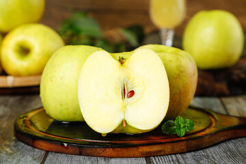 Fresh Green Apples Cut in Half - Crisp Healthy Fruit on Wooden Board