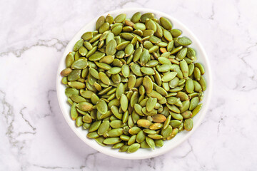 Roasted Pumpkin Seeds in White Bowl - Studio Food Photography