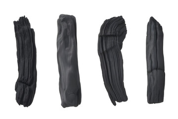 Different types charcoal pieces on transparent background 