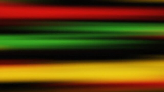 Abstract blurred horizontal stripes background in red green yellow and black colors