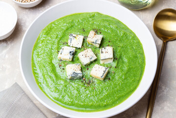 Green broccoli soup with blue cheese. Vegetarian. Healthy eating.