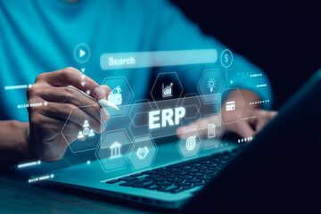 Business people using a laptop with document management for ERP. Enterprise resource planning concept,Enterprise Resource Management ERP software system for business resources plan presented.