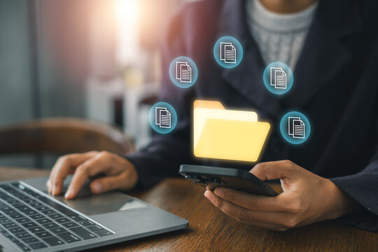 Visual representation of a digital management system using a smartphone and laptop for seamless data organization and communication.