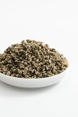 A close-up shot of Chinese tea leaves, against a simple white background.