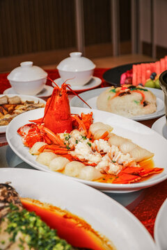 The New Year's Eve dinner table in China, filled with a festive and joyful red atmosphere.