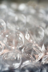 Clear glass balls arranged in a pile