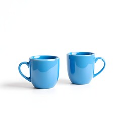 Pair of Blue Ceramic Mugs on White: Simple, Bright, and Ready for Beverages