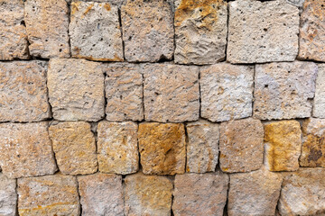 Texture of very old wall made of Limestone brick for background
