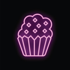 Bright pink neon sign in the shape of a cupcake, with icing and a paper cup