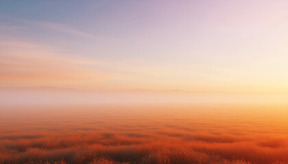 A serene sunrise over a misty landscape, with warm orange and yellow hues illuminating the horizon.