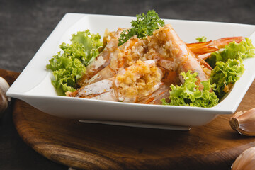 Delicious Garlic Prawns with Fresh Lettuce Garnish.