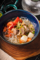 Delicious Indonesian Beef Soup with Vermicelli and Vegetables.