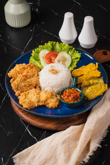 Delicious Indonesian Fried Chicken with Rice and Sambal.