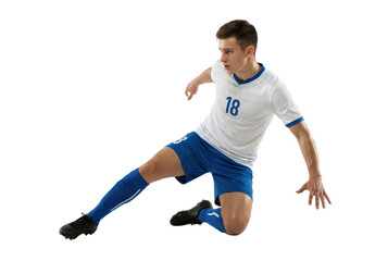 Male soccer player sliding tackle in blue and white uniform isolated