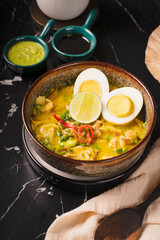 Delicious Indonesian Soto Ayam with Boiled Eggs and Lime.